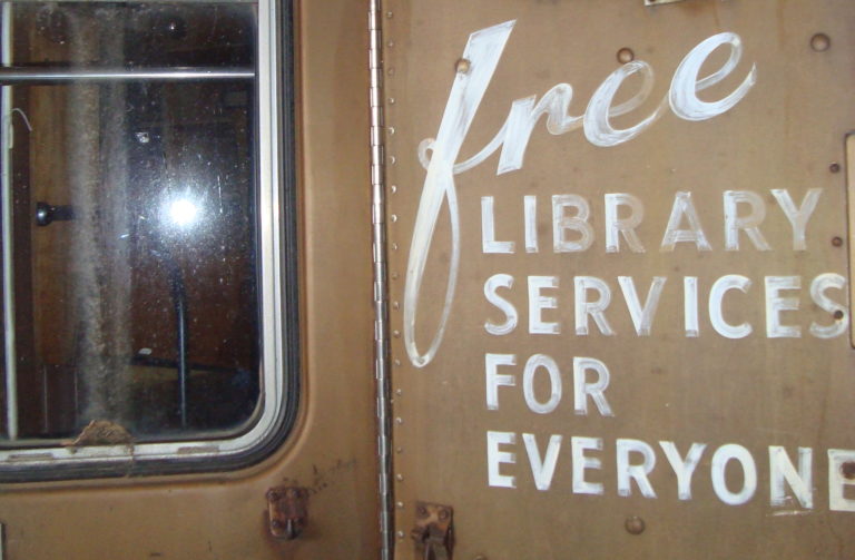 The side of the Door County bookmobile states its mission: to deliver free library services for everyone. Image courtesy of Julie Hein.The side of the Door County bookmobile states its mission: to deliver free library services for everyone. Image courtesy of Julie Hein.