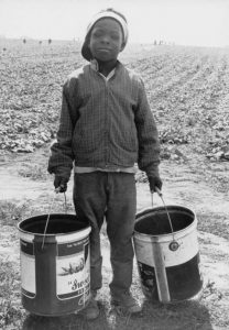 A nine year old migrant worker leaving the pickle fields on strike against Libby, McNeill, & Libby Inc. food company in 1967. Image courtesy of the Wisconsin Historical Society, Image ID: 91644.