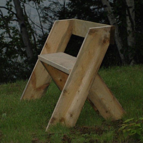 An image of a leopold bench in the woods