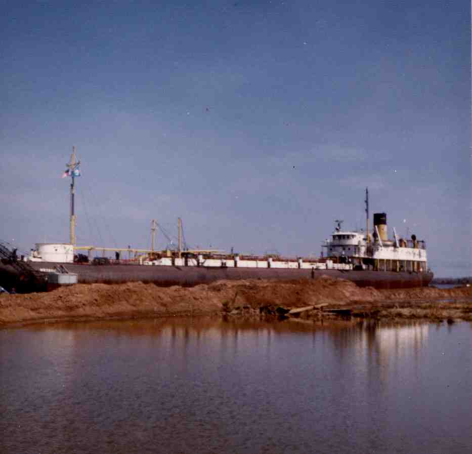 A color photograph the beached SS Meteor, a whaleback ship now part of the Superior Museum