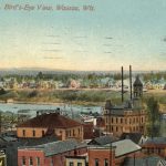 a color postcard showing a bird's eye view of downtown Wausau