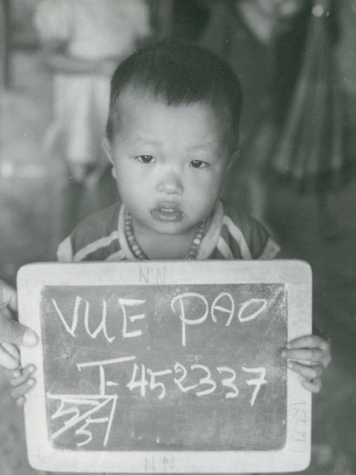 A black and white image of the author as a young boy in a Thai refugee camp