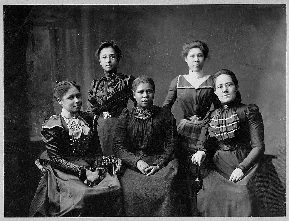 A black and white photo showing five African American women.