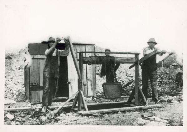 photo of early Wisconsin lead miners operating a windlass