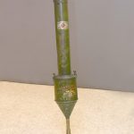 image of a green hand-powered vacuum