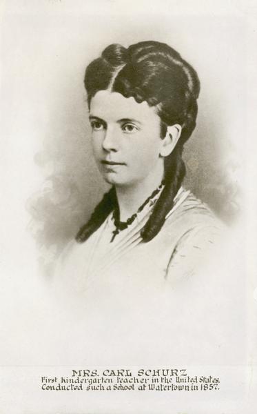 a portrait of a young woman wearing a light colored dress