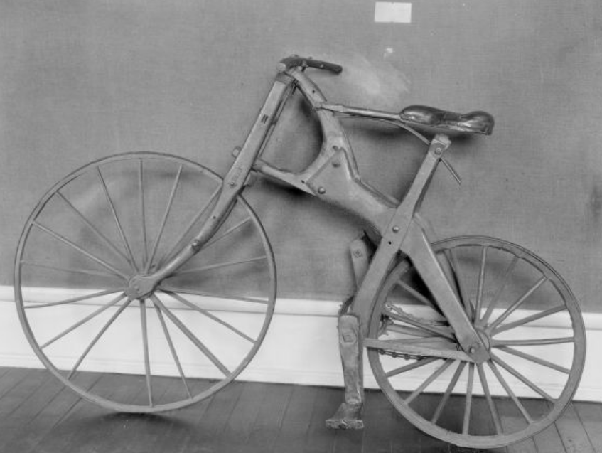 a black and white picture of the Crab Tree Special bicycle, showing the wooden frame and wheels