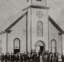 People posing in front of the Norwegian Luthern Church in Juneau