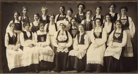 Women participating in a sewing circle in Stoughton, Wisconsin wearing Norwegian costume.