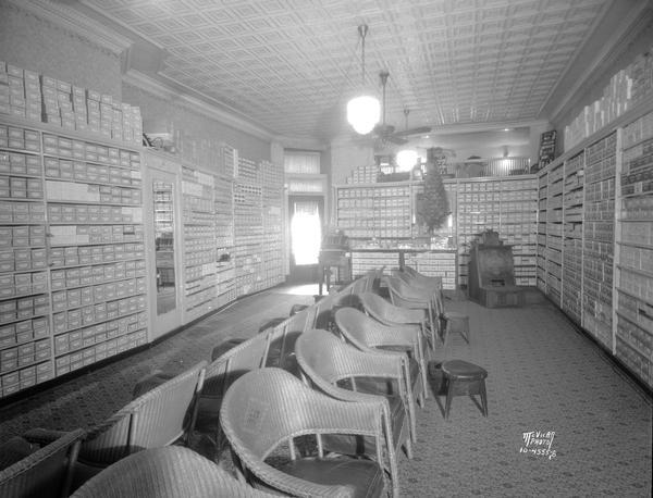 Huegel and Hyland Shoe Store, interior view, showing the x-ray machine in the background, 112 King Street, Madison, Wisconsin. 