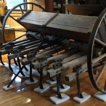Esterly Broadcast Seeder - Seeder on large wagon wheels