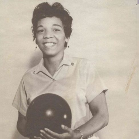Earlene Fuller poses with a bowling ball.