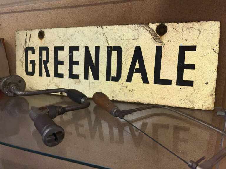 A ratchet brace and a coping saw from Jack's toolset. From the collection of the Greendale Historical Society.