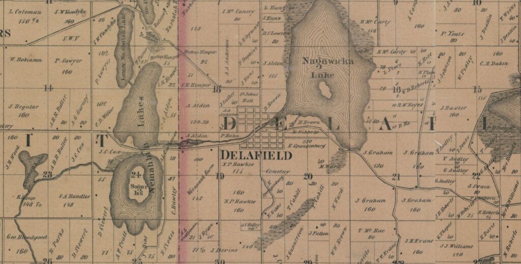 An 1859 map centered on the village of Delavan on the southern end of Nagawacka Lake. Two roads extend through the map and cross at Delafield, one running north and south, and the other running east and west.