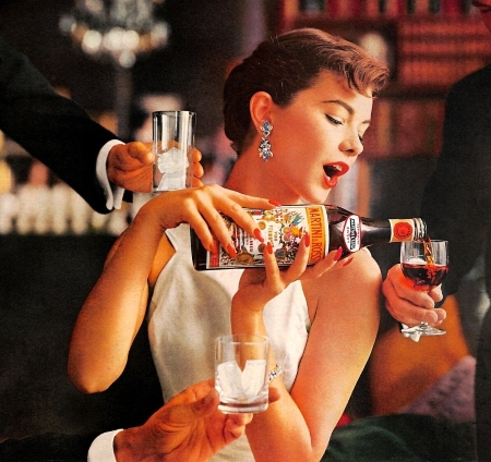 A print ad for Martini & Rossi showing a woman, finely dressed, pouring vermouth into a cordial glass. Two other hands, each holding glasses reach into the photograph.