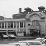 A black and white photograph of the facade of the Al Ringling Theatre.