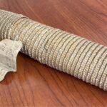 A woven straw document case.