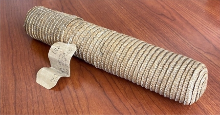 A woven straw document case.