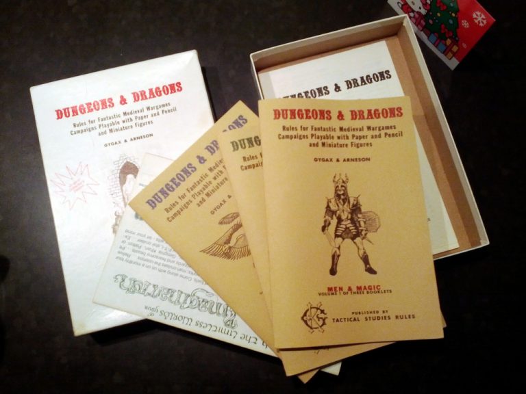 A Dungeons and Dragons game box with rule books. The books are tan and feature the image of a knight and red lettering spelling out the title.