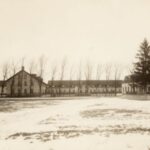 Black and white photo of Esterly Harvesting Machine Company buildings.