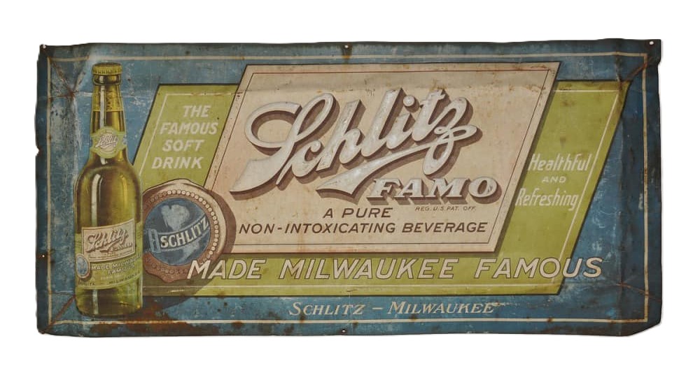 An antique metal sign advertising Schlitz FAMO. Text reads, “A pure non-intoxicating beverage”