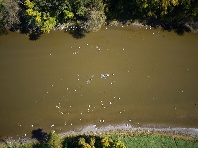 Aerial view of the Crawford River with stone remnants of a fishing weir.