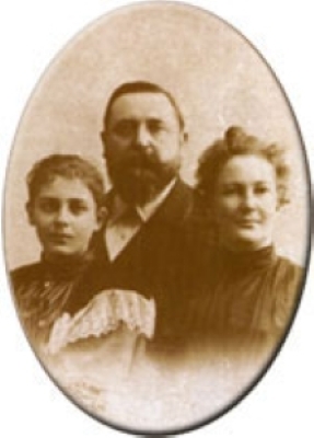 A family portrait of a man, woman, and teenage daughter.