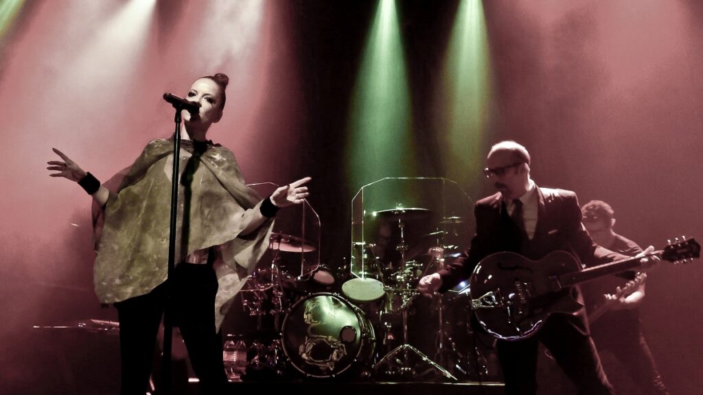 Photo of a live performance by the band Garbage.