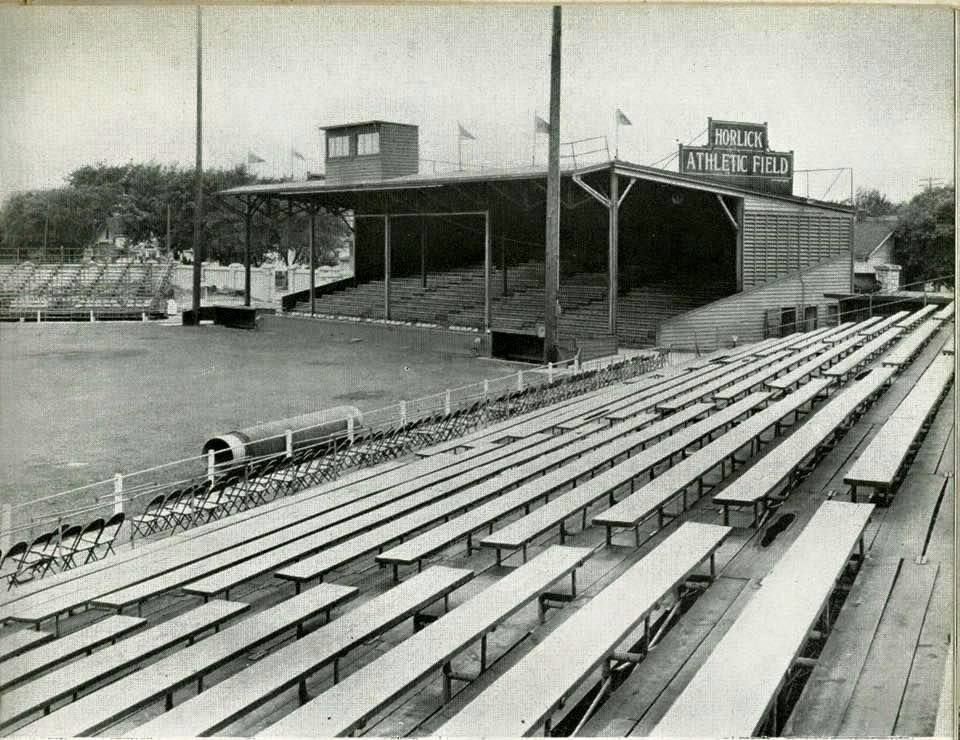 Historic photo of Horlick field, showing bleachers set up on either side of a grandstand, baseball pitch at the center.