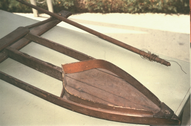 Photograph of a model of a Madison-style ice boat during restoration.
