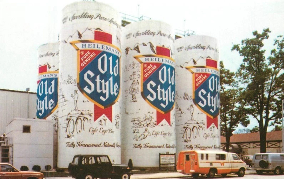 Postcard image of silos painted to look like Heileman's Old Style beer cans.