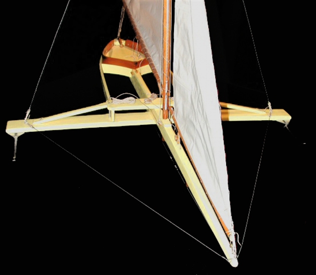 Detail, model of a Madison-style ice boat showing the backwards-angled mast and trussed runner plate.