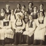 Women participating in a sewing circle in Stoughton, Wisconsin wearing Norwegian costume.