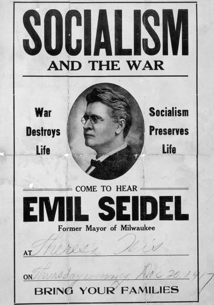 Mass-produced poster advertising a public speech by Emil Seidel. The poster features a 3/4 profile portrait of Emil Seidel, and the text reads, "Socialism and the War. War Destroys Life. Socialism Preserves Life. Come to hear Emil Seidel, Former Mayor of Milwaukee. Then below, handwritten script has filled in: At Theresa, Wis. On Thursday evening, Dec 20, 1917.