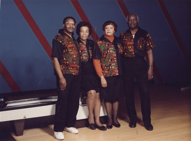 A bowling team wearing uniforms of Fuller's design, featuring Kente cloth patterns.