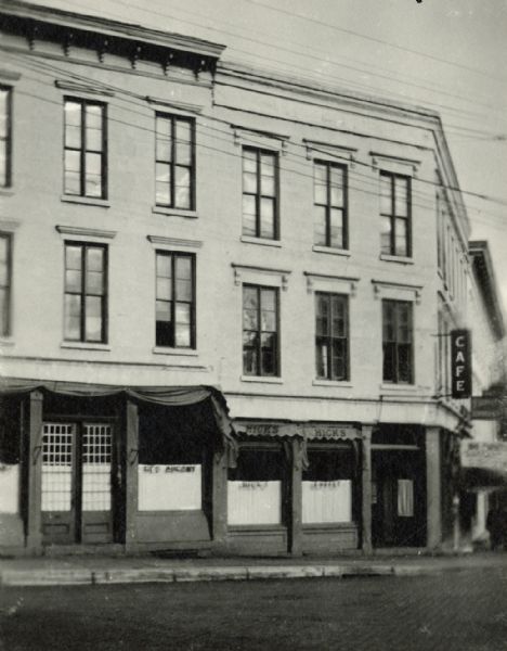 The front of the Emigranten Office, a three-story brick building, in downtown Madison