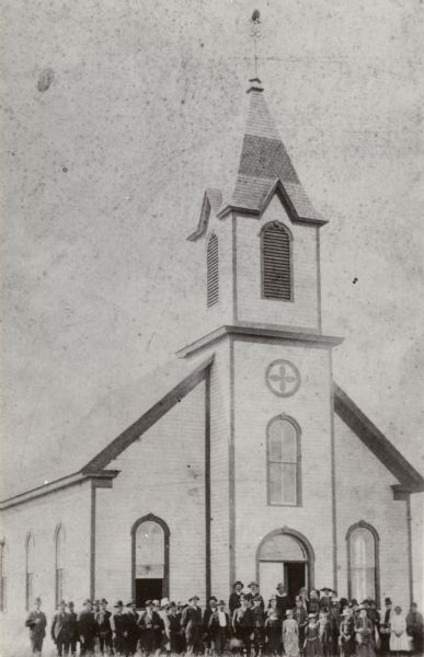 A congregation posing in front of the Norwegian Lutheran Church in Juneau.