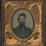 Framed tintype portrait of Doctor James T. Reeve in a copper oval frame with Americana motifs.