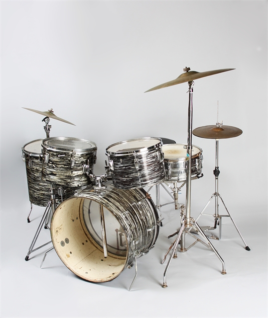 Well-used drum set with silver and black "Oyster Black Pearl" finish.