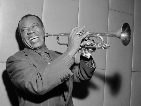 Portrait of Louis Armstrong with his trumpet.