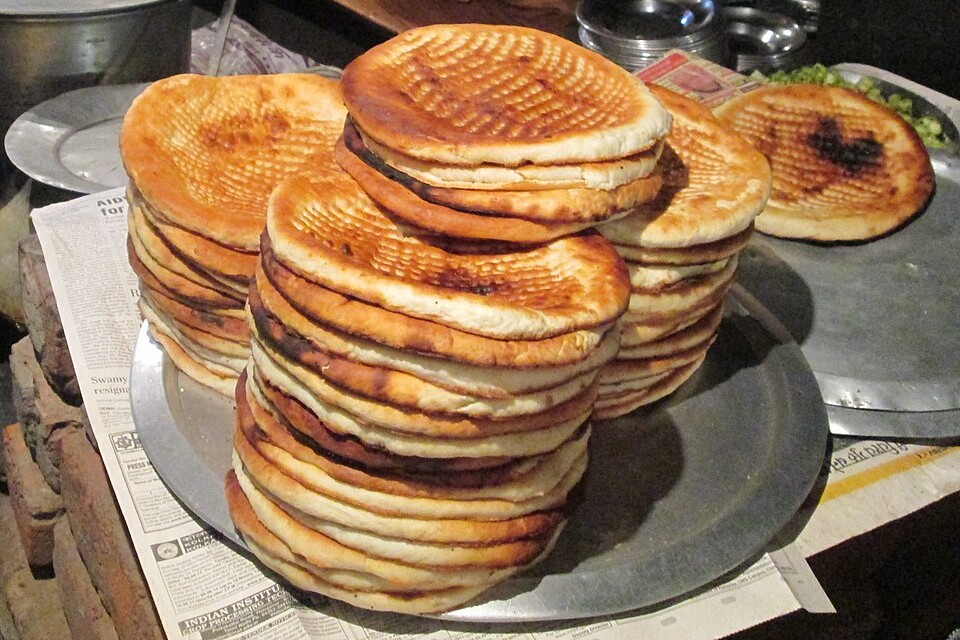 Piles of f=different varieties of Indian Naan.