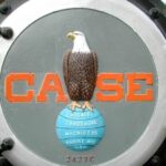 Image of the Case Corporation Logo, featuring an eagle, modeled on Old Abe, atop a globe and the company name, "CASE"