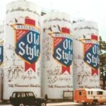 Postcard image of silos painted to look like Heileman's Old Style beer cans.