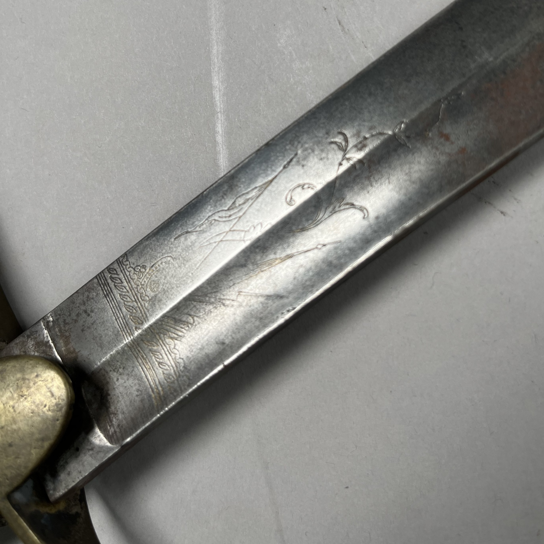 Detail of the blade showing engraving near the hilt.