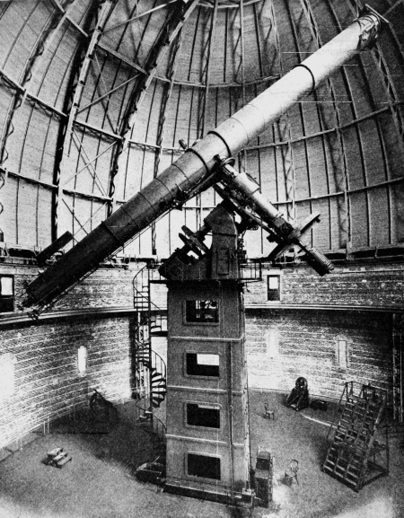 Photograph of the 40-inch refractor telescope inside the dome of Yerkes Observatory.