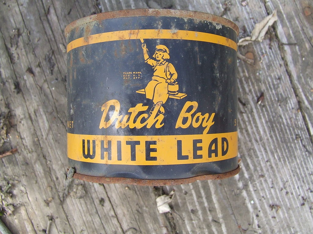 A can of Dutch Boy "White Lead" Paint. Blue can features the image of a boy in traditional Dutch costume holding a paint brush.