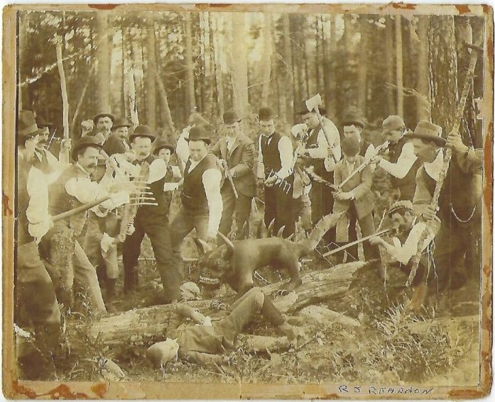 Photo of a group of men recreating the capture of a hodag