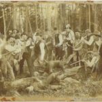 Photo of a group of men recreating the capture of a hodag