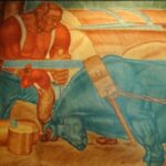 Painted wall mural of the giant Paul Bunyan, his mythical blue ox, Babe, and two lumberjacks.