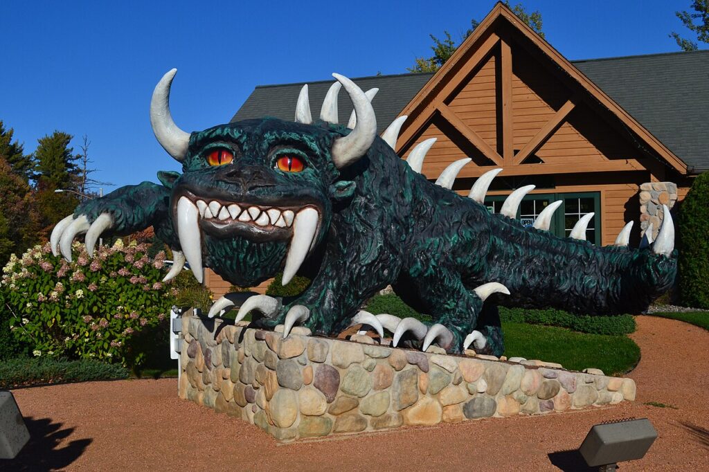 Photograph of the Hodag statue in front of the Rhinelander Chamber of Commerce building.